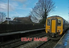 PHOTO  CLASS 156 SET 156486 MILLS HILL STATION THE 12:12 TO WIGAN WALLGATE ARRIV