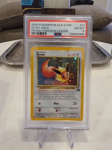 Pokemon 2000 Eevee 11 Holo SWIRL Black Star Promo PSA 8