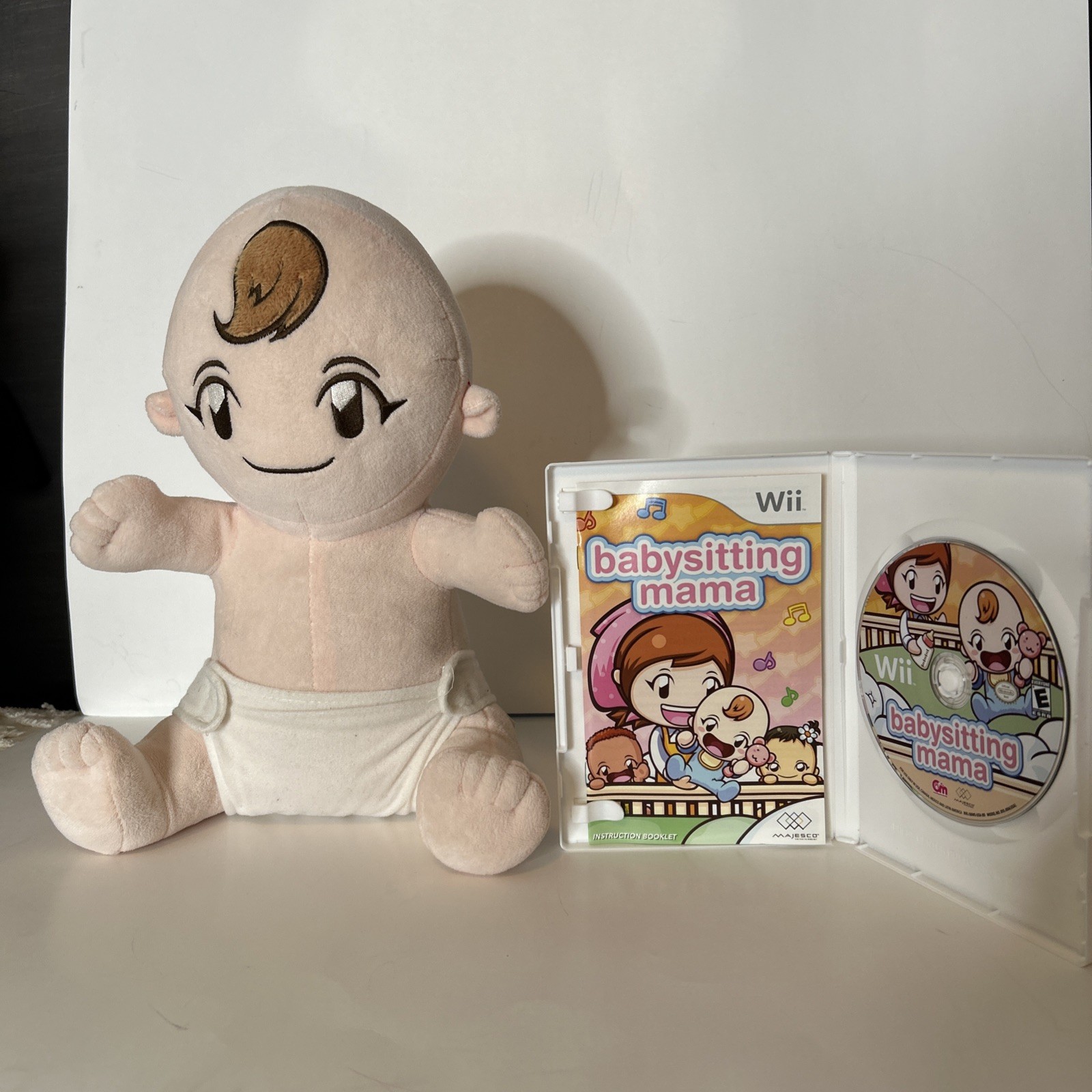 Nintendo Wii Babysitting Mama game with baby doll plush Majesco