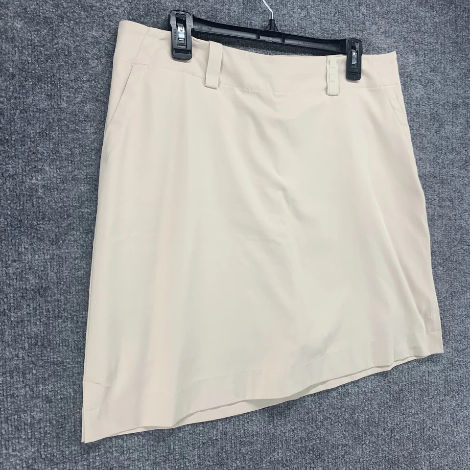 Falda corta de golf NIke para mujer 14 beige Dri Fit elástica rendimiento activo 34 Foto 2 de 4