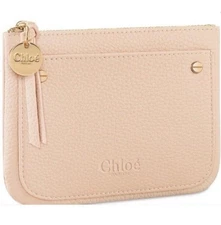 Women’s Chloe light pink / cream wristlet or wallet with zip closure.