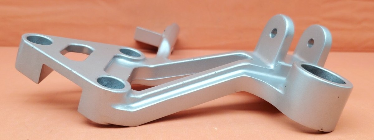 88-97 KAWASAKI ZX600 NINJA LEFT MUFFLER STAY FOOTPEG BRACKET