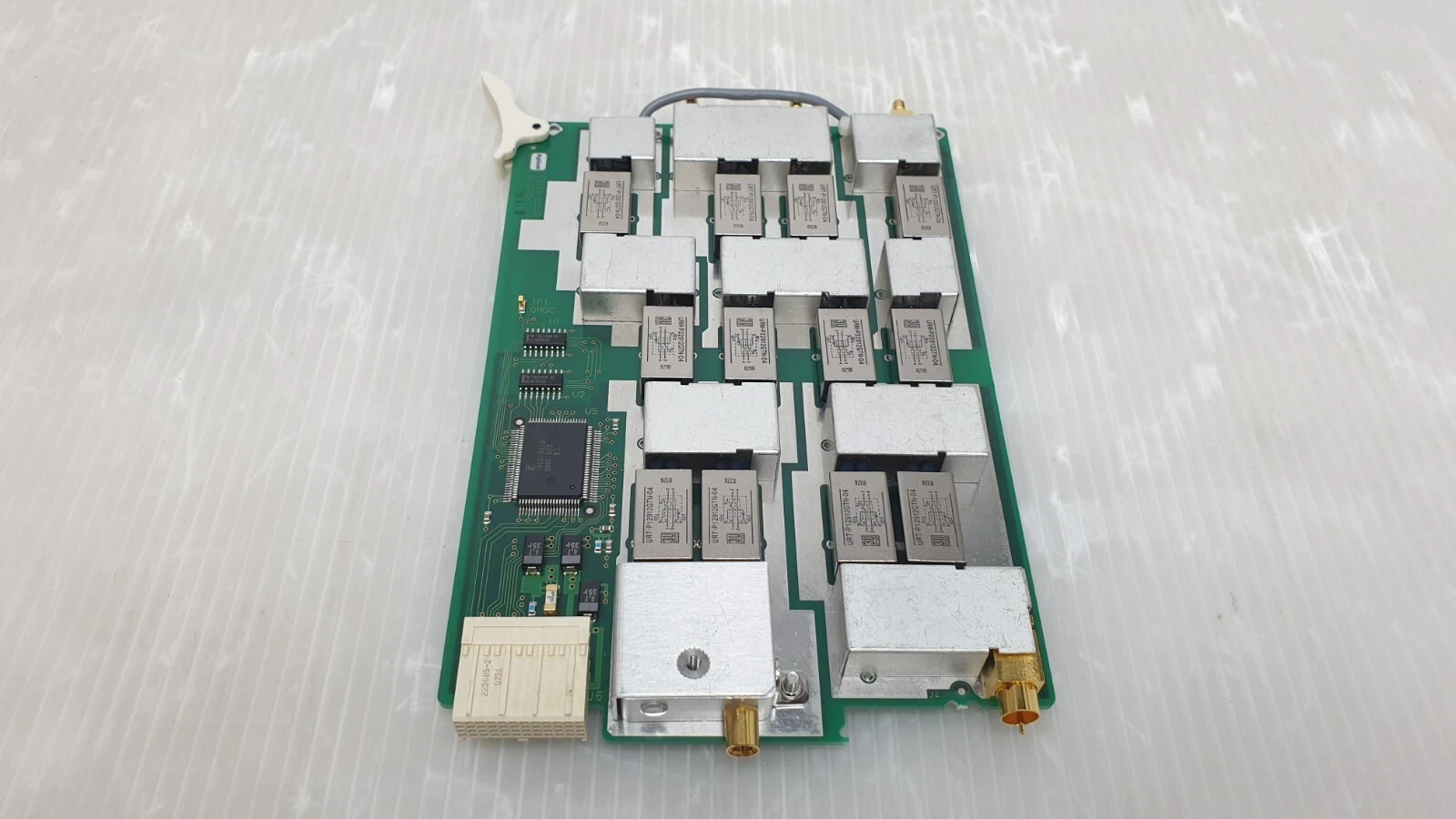 Agilent E3120-66512 board from the lever end, rows of relays and shield boxes