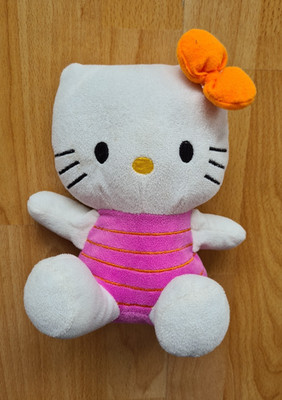 Hello Kitty in pinkem Anzug und oranger Schleife, 20x20x12 cm