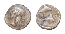 Islands off Thrace, Thasos AR Obol. Circa 400 BC. Head of satyr right / Dolphin