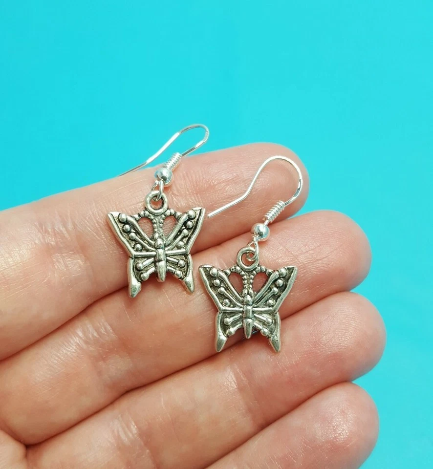 Bonitos pendientes colgantes de mariposa con ganchos de plata de ley tibetanos Foto 2 de 4
