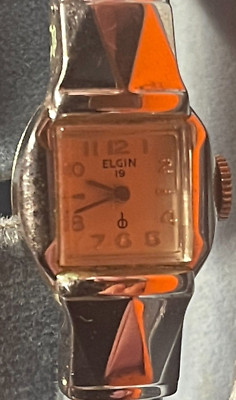 1961 lady Elgin watch 10 K RGP case and band.  Shock Proof model with all Papers