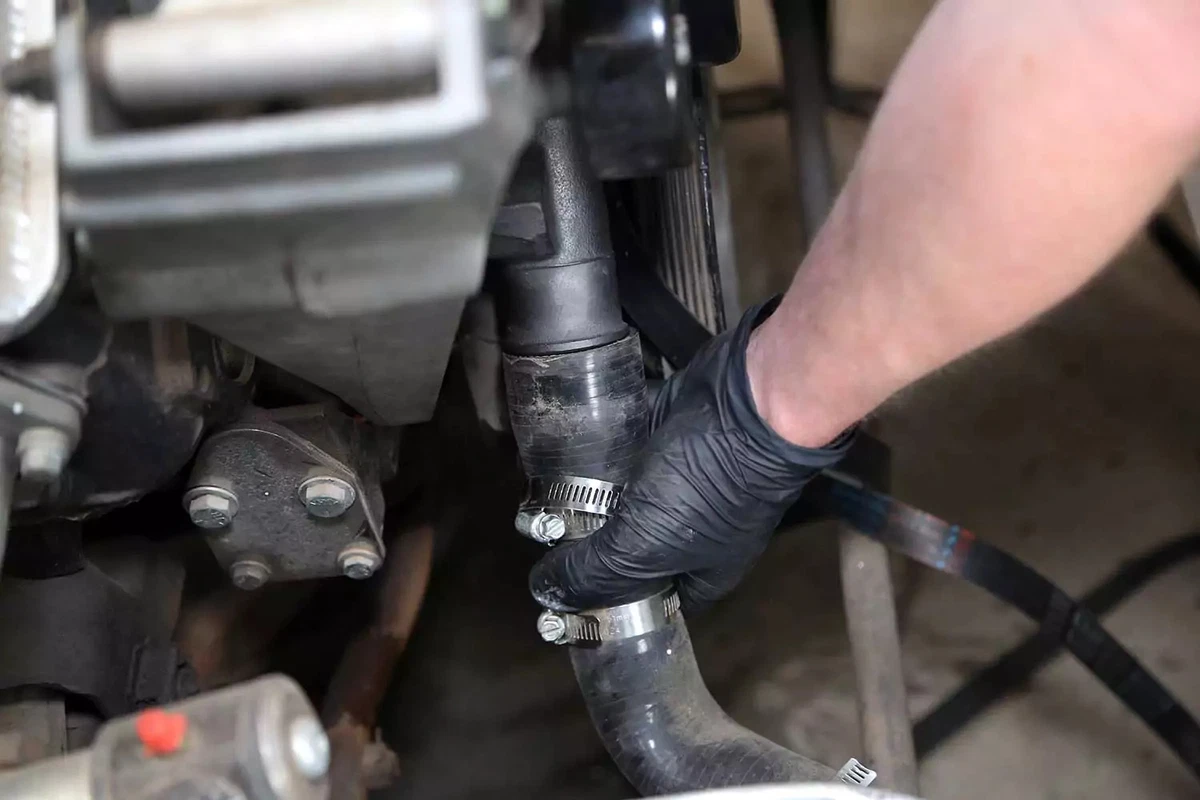 The lower radiator hose is reinstalled.