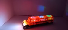SCHOOL BUS LIGHT UP BUMP- N- GO ACTION WITH SOUND AND MUSIC (BATTERIES INCLUDED)