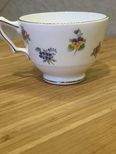 A Crown Staffordshire fine bone china teacup with floral pattern and gold rim.EC