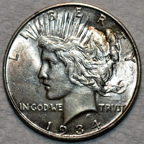 About Uncirculated 1934-D Peace Dollar, Highly Lustrous, Tougher Date.