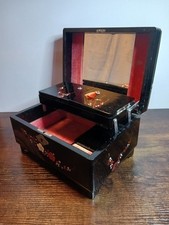 This is a vintage 1950 - 60s Japanese black lacquer musical jewellery box.