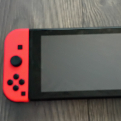 Nintendo Switch Console Handheld System w/ Neon Red & Blue Joy-Con Controllers