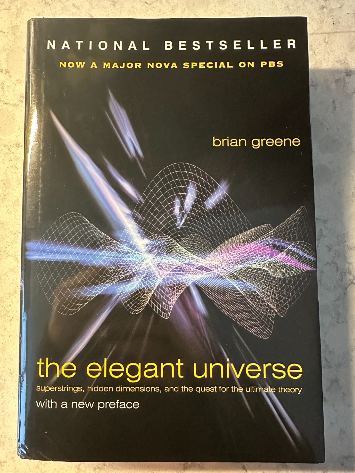 The Elegant Universe: Superstrings, Hidden Dimensions, and the Quest