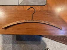 We've all got hang-ups, they're rarely this cool-looking. 2 Vintage Wood Hangers