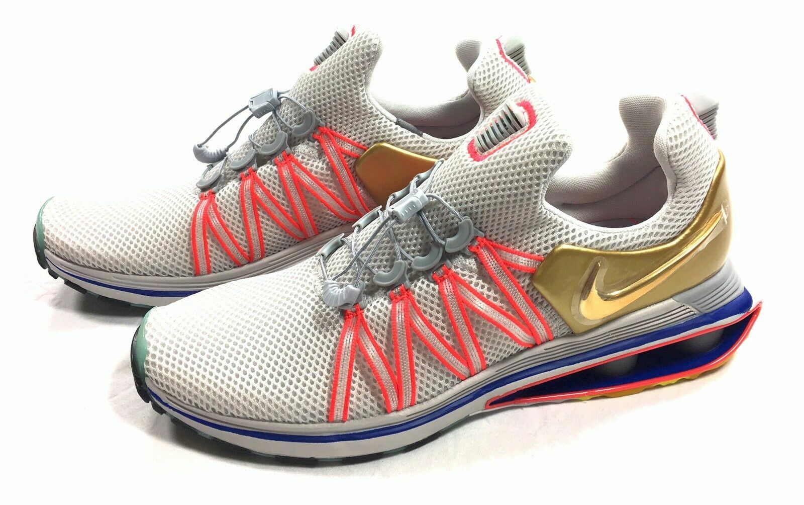 nike shox gravity metallic gold