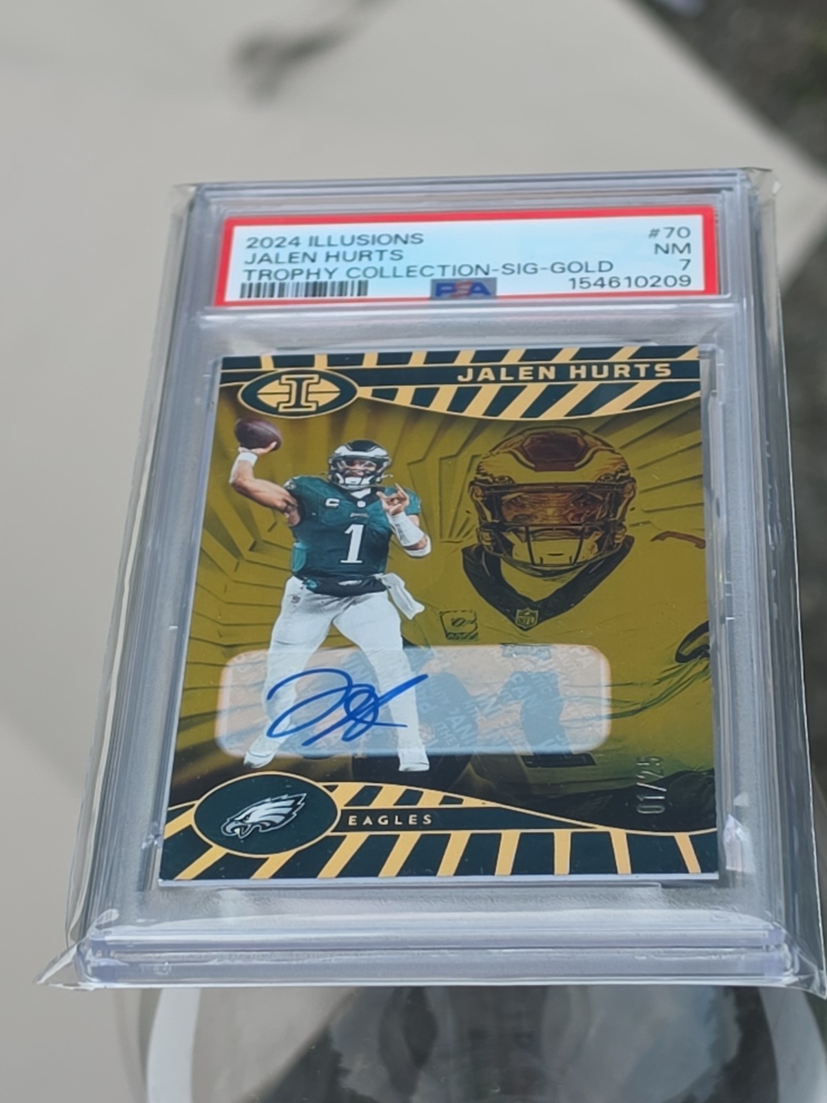 Jalen Hurts 2024 Panini Illusions #70 Trophy Collection Gold Auto #/25 PSA 7 view 2