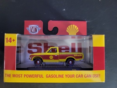 2025 M2 Machines 1977 DATSUN PICKUP Yellow Shell Oil R99 Near Mint