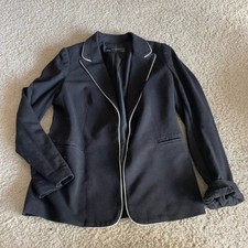The limited black blazer with white trim