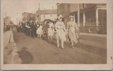 RPPC Postcard Parade People in Costume Walking Down Street C. 1900s 