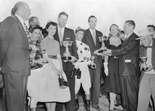 Eddie Arcaro receives trophy after Nashua-Swaps raceFrom left- 1955 Old Photo