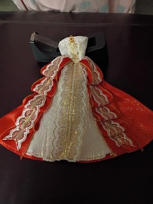 In four b fashioned dolls , red gold , fancy dress down to tallic nineteen ninet