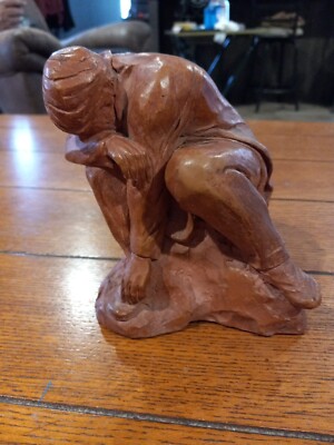 The Kneeling Man Sculpture signed Sc copyright, clay  terracotta color.