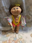 Cabbage Patch Kids Splash N’ Tan girl brown hair violet   eyes