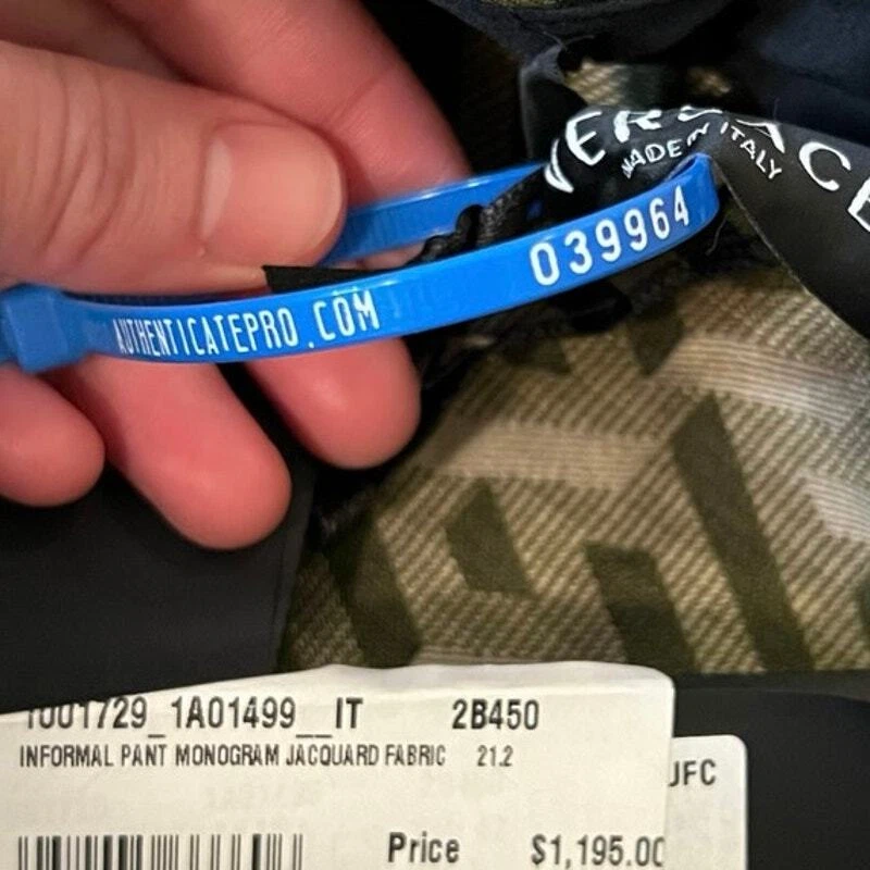 Pantalone jacquard Versace nero e kaki monogramma nuovo con etichetta taglia 42 M