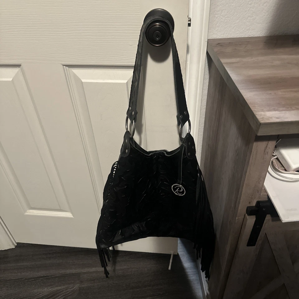 Hobo con flecos Nancy de cuero negro Raviani Foto 3 de 4