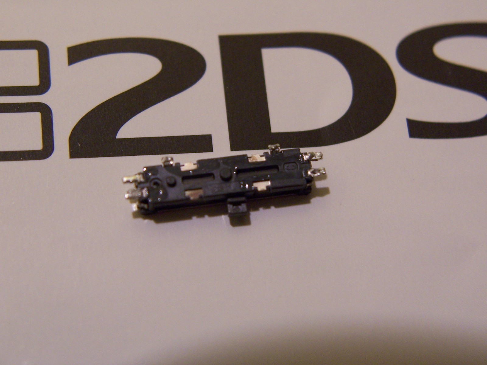 Authentic Nintendo 2DS Repair Part Volume Switch / Slider Button - Afbeelding 2 van 2