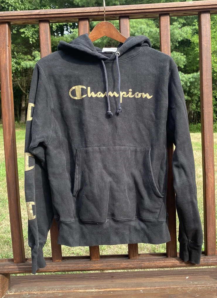 Gold and black champion hoodie top