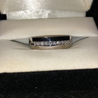 Classic 10K white gold wedding band featuring 11 channel set diamonds 6mm width