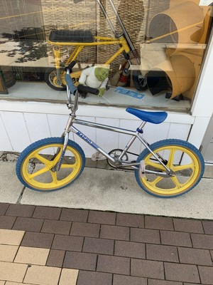 blue and yellow bmx bike