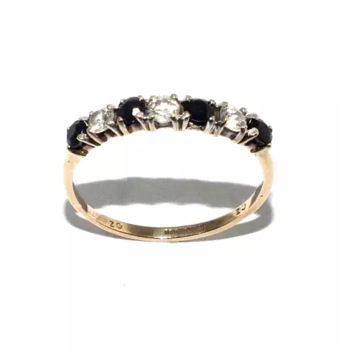 Ladies 9ct yellow gold half eternity ring set with dark sapphires & clear stones