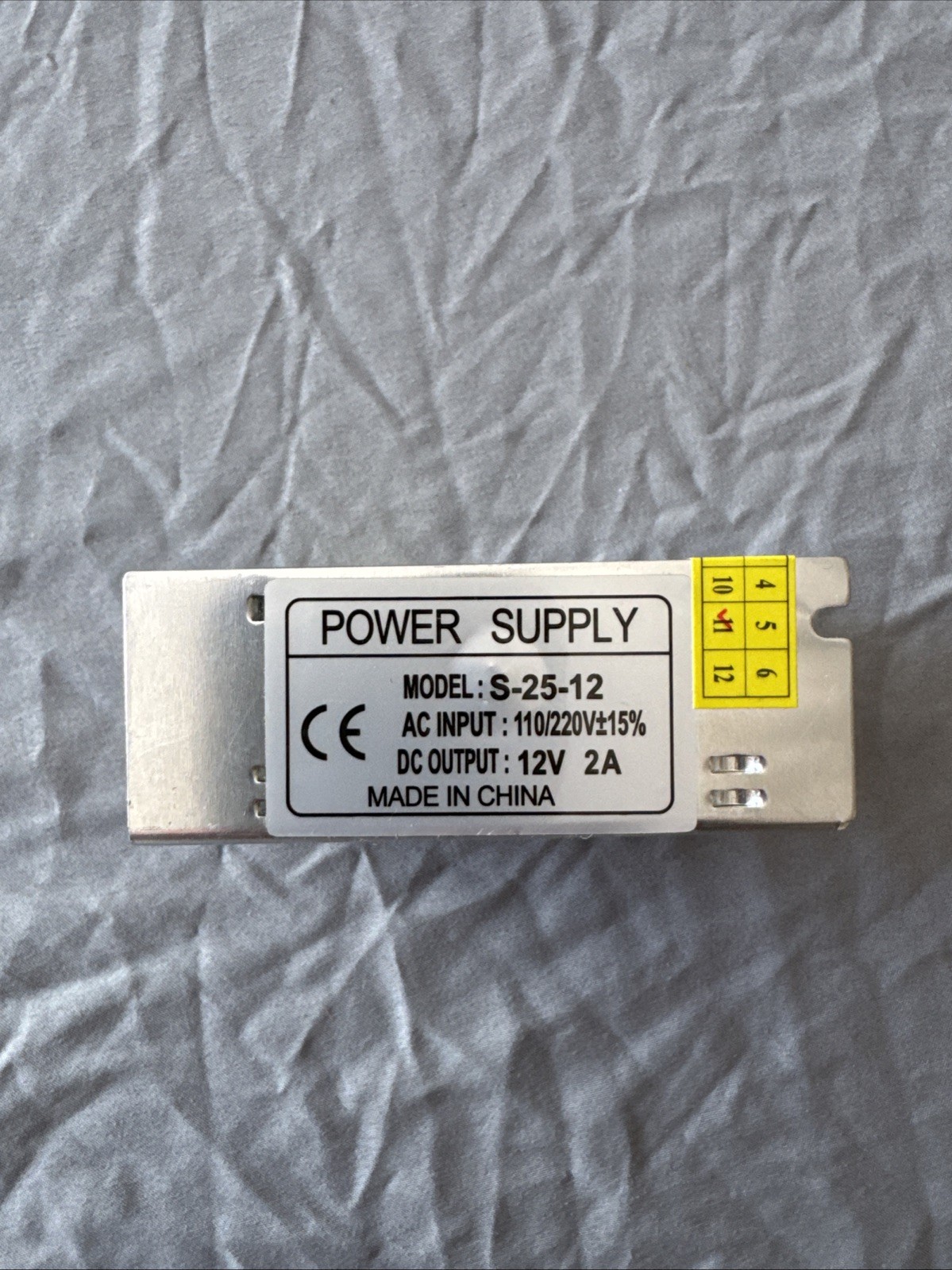 Power Supply Model S-25-12 AC Input :110/220. +/- 15%. DC output: 12v 2A
