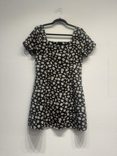 Black and white floral mini dress with square neckline and puff sleeves