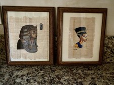 Framed Egyptian hand painted images on papyrus. The pharaoh and Nefertiti.