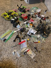 4 FPV drones plus a bunch of parts and FPV drone accessories (need fixing)