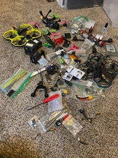 4 FPV drones plus a bunch of parts and FPV drone accessories (need fixing)