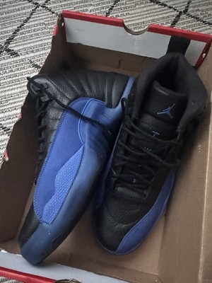 Air Jordan sneakers black leather upper with vibrant Game Royal blue accents