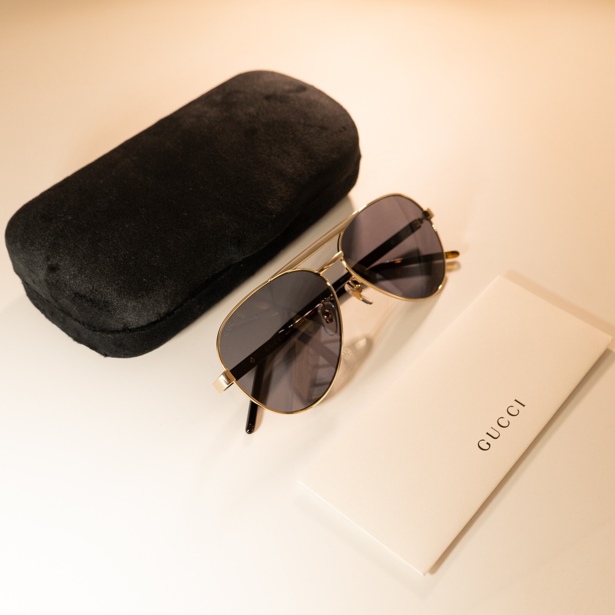 Authentic Gucci GG1163S aviator sunglasses in gold with grey lenses. Gucci GG1163S 001 Sunglasses Men main image 4