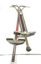 LOT OF A PAIR 2 VINTAGE POGO STICKS 43 AND 1/2 INCHES TALL AND 40 INCHES TALL