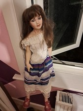 Vintage collectable porcelain doll with stand