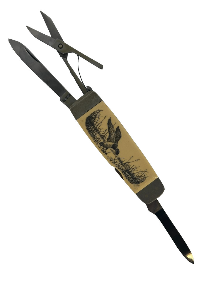 Vintage Gerber multi-tool with a hand-engraved duck motif — a genuine piece of American knife heritage that doubles as wearable art.