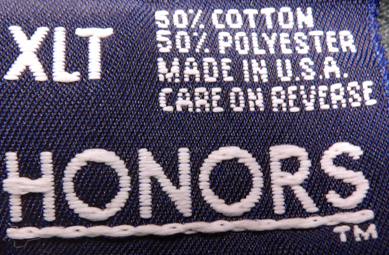 White VTG Honors XLT men’s gray pocket tee with black thread, front pocket, and “50% cotton 50% polyester made in U.S.A.” label.