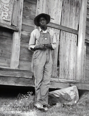 1939 Black Farmer in Overalls Leaning Against a Barn, Vintage Photo Reprint