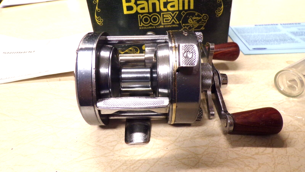 SHIMANO BANTAM FISHING REEL W/ BOX - BANTAM 100-EX - WORKS SHIMANO BANTAM FISHING REEL W/ BOX - BANTAM 100-EX - WORKS