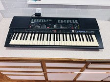 Yamaha PortaTone PSR-500 61-Key Portable Electronic Keyboard with Power Adapter