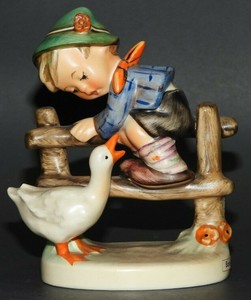 hummel boy on fence with goose